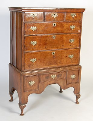 Lot 108 - An 18th century Queen Anne walnut chest on stand