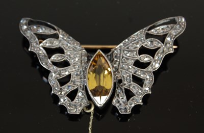 Lot 512 - A 20th century yellow-green sapphire and diamond set butterfly brooch