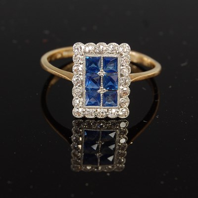 Lot 516 - A mid 20th century yellow and white metal Art Deco style sapphire and diamond cocktail ring