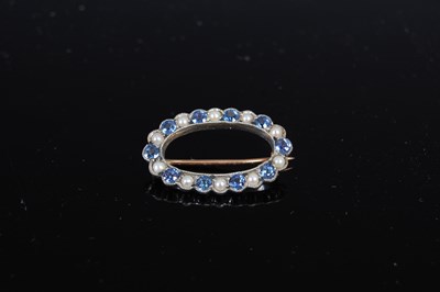 Lot 490 - A mid 20th century white and rose metal sapphire and pearl set oval brooch