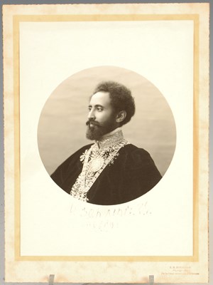 Lot 200 - A sepia toned portrait photograph of Haile Selassie 1892-1975