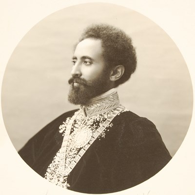 Lot 200 - A sepia toned portrait photograph of Haile Selassie 1892-1975