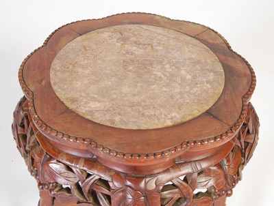 Lot 8 - A Chinese dark wood urn stand, early 20th century