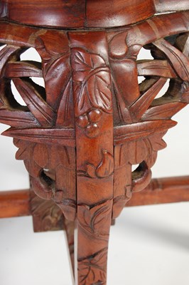 Lot 8 - A Chinese dark wood urn stand, early 20th century
