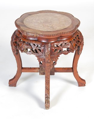 Lot 8 - A Chinese dark wood urn stand, early 20th century
