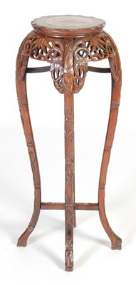 Lot 44 - A Chinese dark wood urn stand, Qing Dynasty