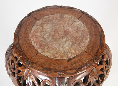 Lot 44 - A Chinese dark wood urn stand, Qing Dynasty