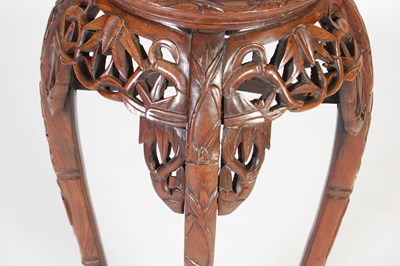 Lot 44 - A Chinese dark wood urn stand, Qing Dynasty