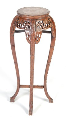 Lot 44 - A Chinese dark wood urn stand, Qing Dynasty