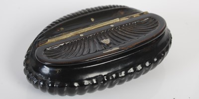 Lot 251 - A black papier-mâché oval snuff