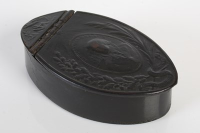 Lot 304 - A pressed leather navette-shaped snuff box