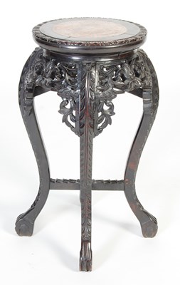 Lot 21 - A Chinese dark wood urn stand, Qing Dynasty