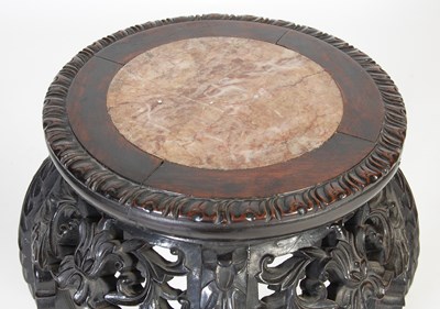Lot 21 - A Chinese dark wood urn stand, Qing Dynasty