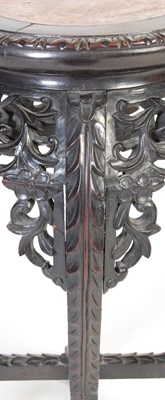 Lot 21 - A Chinese dark wood urn stand, Qing Dynasty