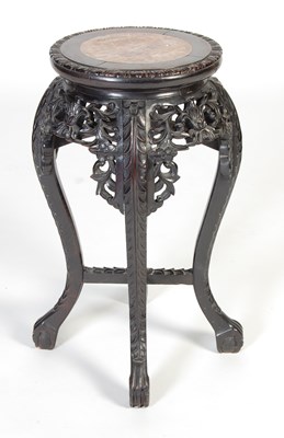 Lot 21 - A Chinese dark wood urn stand, Qing Dynasty