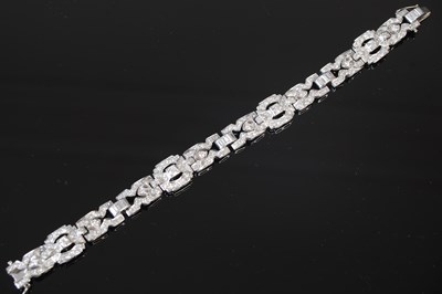 Lot 533 - An articulted Art Deco white metal and diamond set bracelet, circa 1925