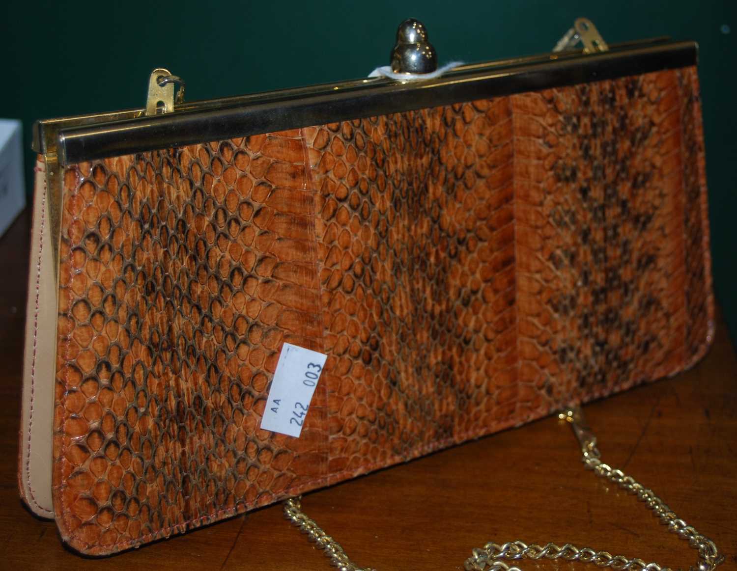 Lot 352 - A faux snakeskin clutch bag.
