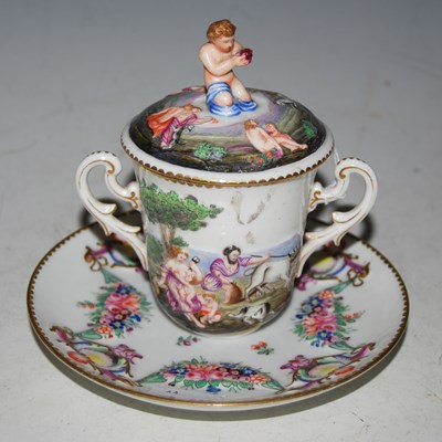 Lot 18 - A Capodimonte porcelain twin-handled cup,...