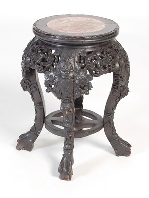 Lot 9 - A Chinese dark wood urn stand, Qing Dynasty,...