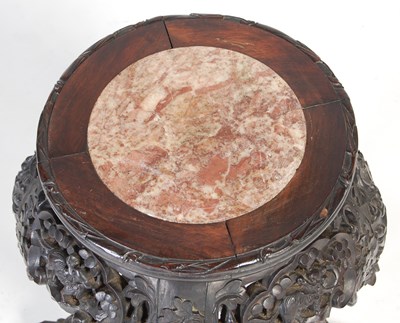 Lot 9 - A Chinese dark wood urn stand, Qing Dynasty,...