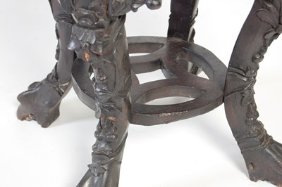 Lot 9 - A Chinese dark wood urn stand, Qing Dynasty,...