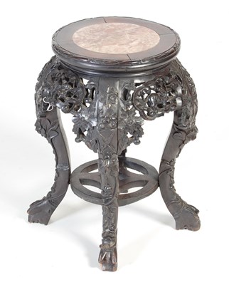 Lot 9 - A Chinese dark wood urn stand, Qing Dynasty,...