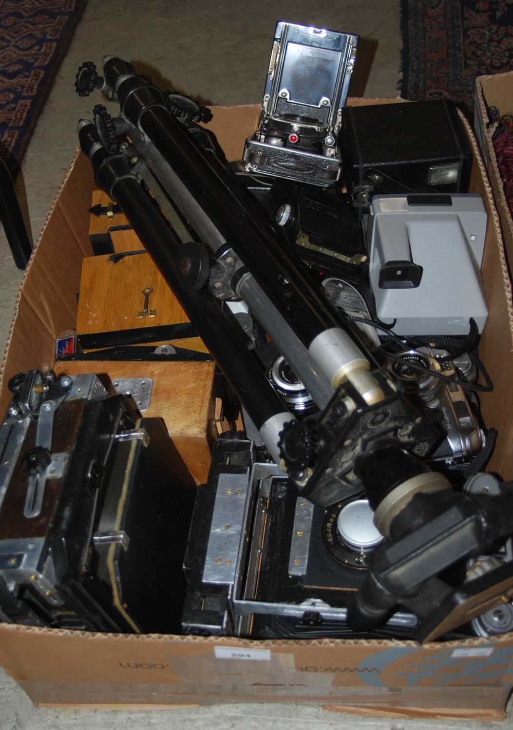 Lot 594 - A box of assorted vintage cameras and camera...