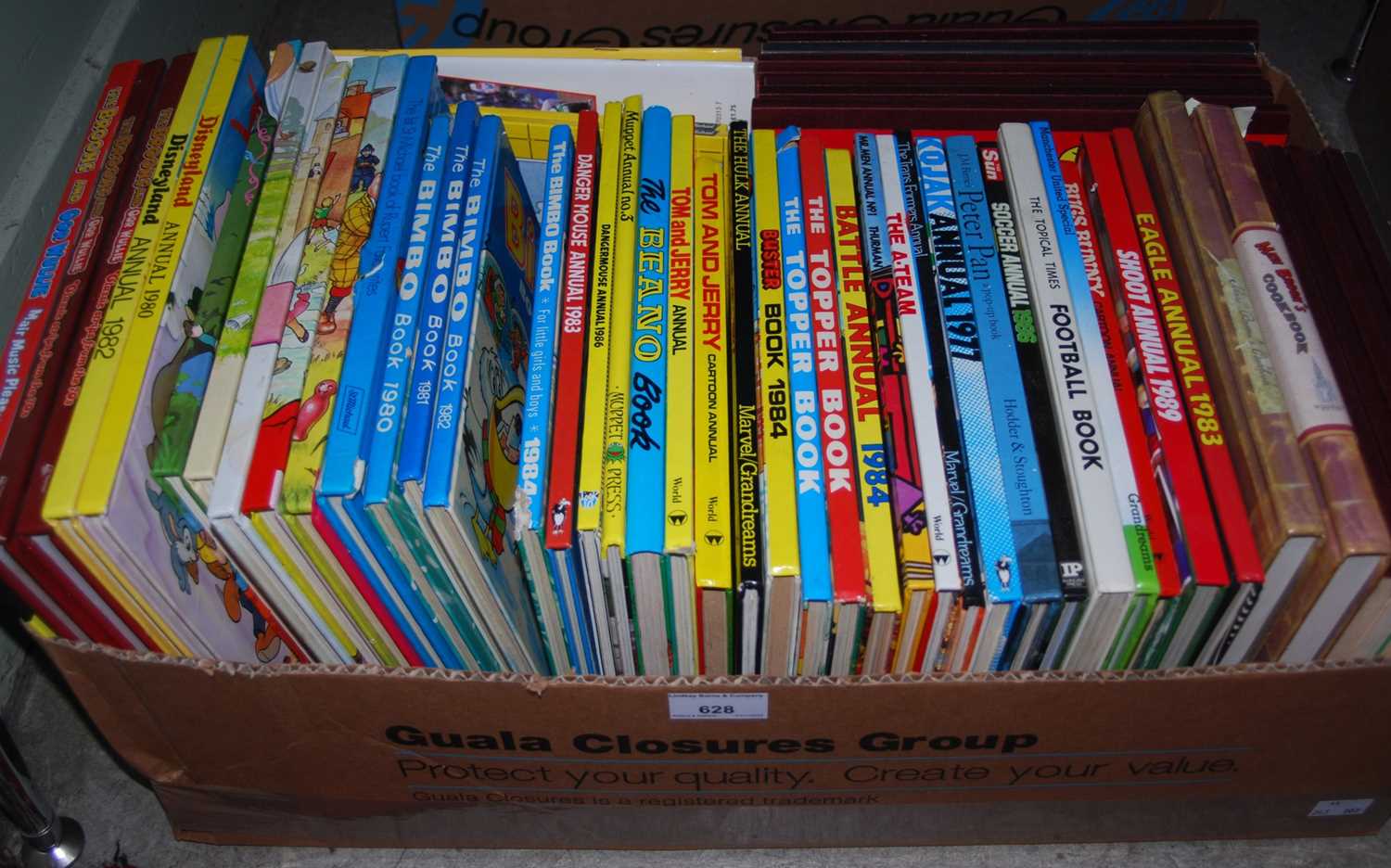 Lot 628 - A box of assorted childrens annuals, and other...