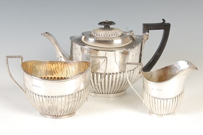 Lot 420 - An early 20th century three piece silver tea...