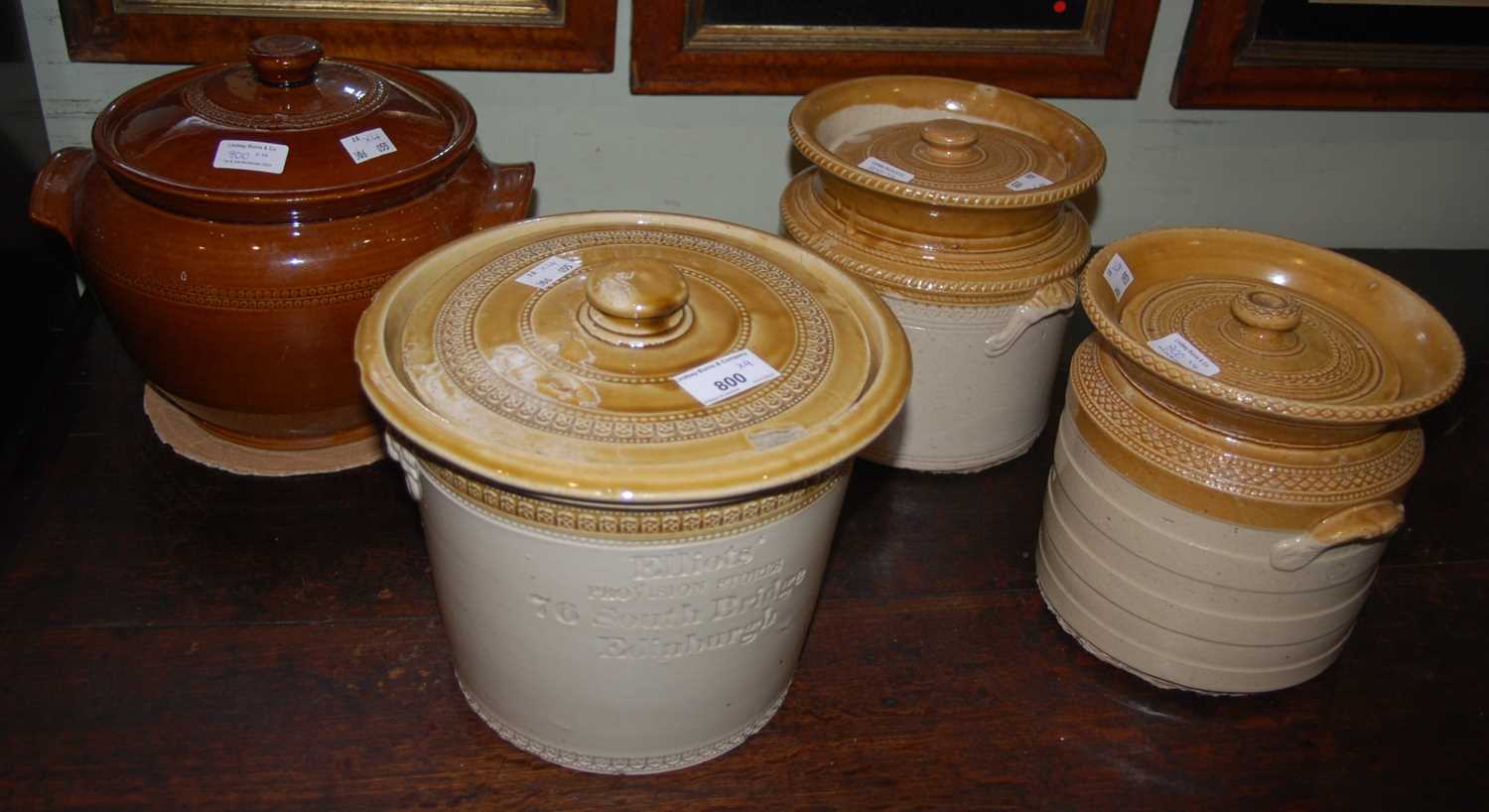 Lot 800 - A group of four vintage stoneware crocks,...