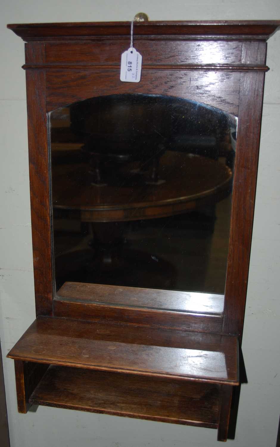 Lot 815 - An early 20th century oak hall mirror,...