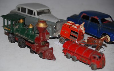 Lot 302 - A collection of vintage toy cars to include...