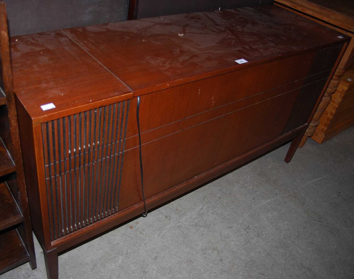 Lot 859 - A mid-century music cabinet containing a...