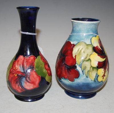 Lot 196 - Two Moorcroft pottery vases comprising a dark...