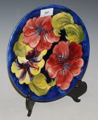 Lot 197 - A Moorcroft pottery plate, decorated with...