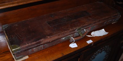 Lot 874 - A vintage leather and brass bound gun case,...