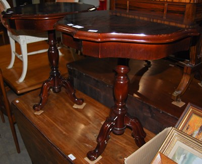 Lot 890 - A pair of reproduction shaped top tri-footed...