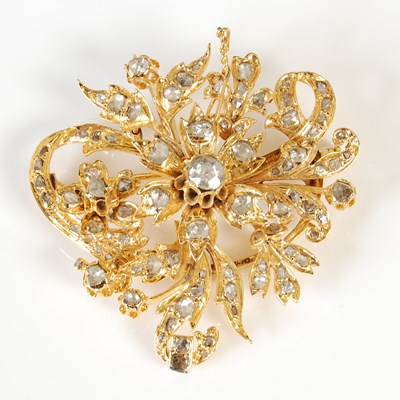 Lot 443 - A yellow metal and diamond set flower brooch,...