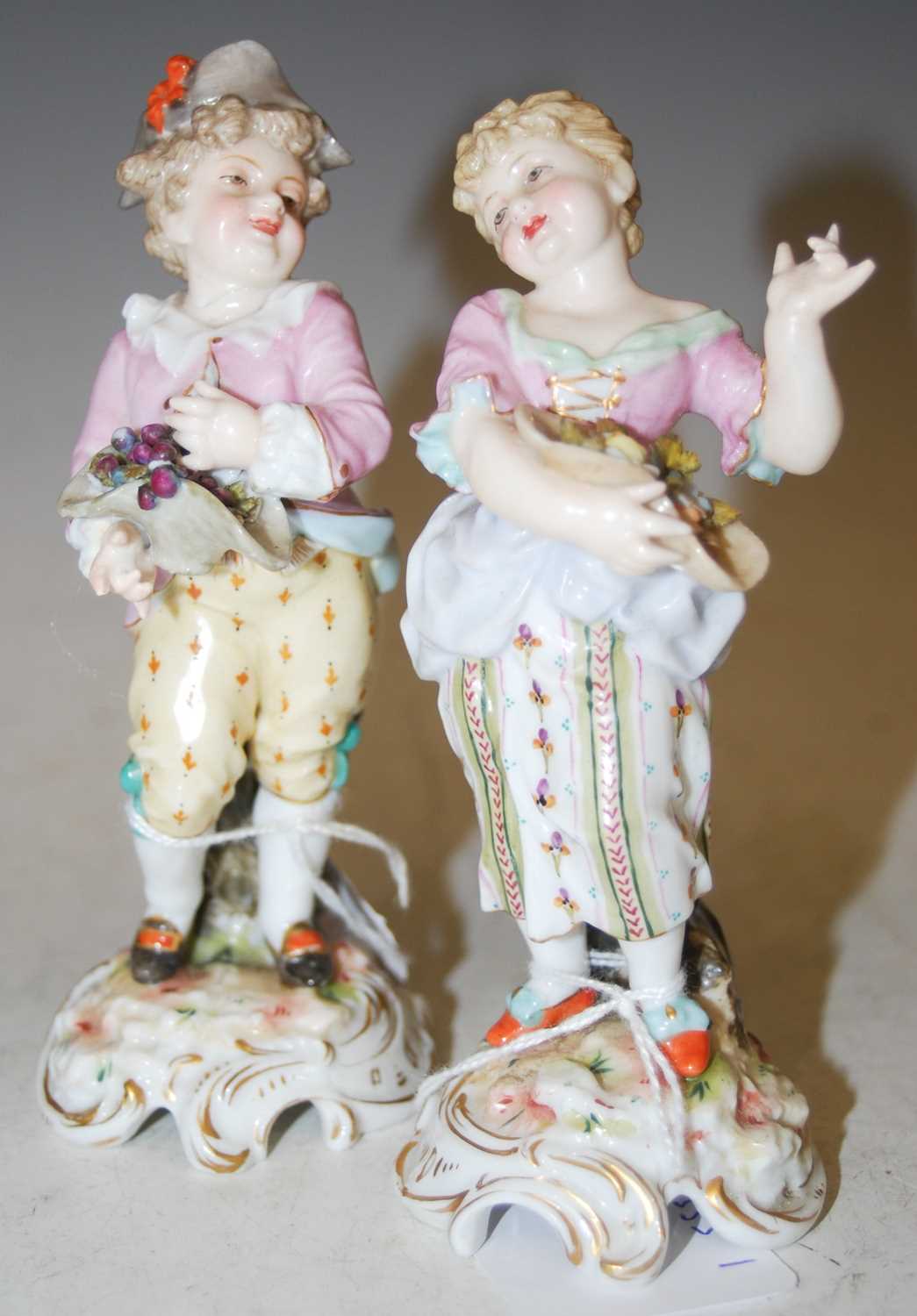 Lot 203 - A pair of Continental porcelain figures, boy...