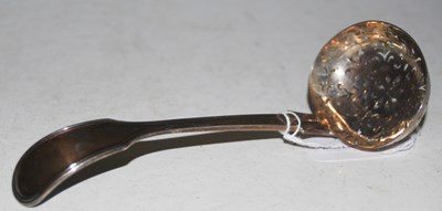 Lot 137 - A London silver fiddle pattern sifting spoon,...