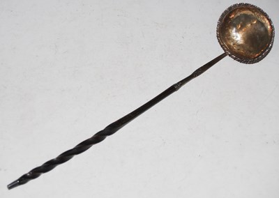 Lot 164 - An antique white metal toddy ladle with baleen...