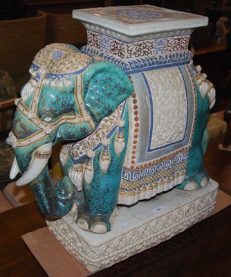 Lot 924 - A ceramic jardiniere stand in the form of an...