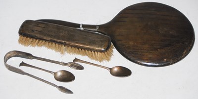 Lot 180 - A collection of silver to include a handheld...