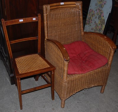 Lot 936 - A wicker elbow chair with bentwood arm rests,...