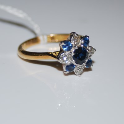 Lot 71 - A white and yellow metal, sapphire and diamond...