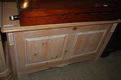 Lot 942 - A set of three limed pine bedside chests of...