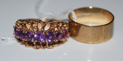 Lot 72 - A 9ct gold and seven stone amethyst dress ring,...