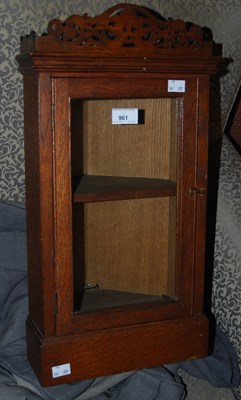 Lot 961 - A small oak corner cabinet with pierced scroll...