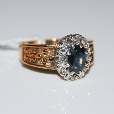 Lot 96 - A 9ct gold, sapphire and diamond chip cluster...