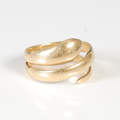 Lot 462 - A yellow metal serpent ring, stamped '18CT',...